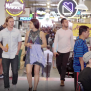 Male and Female Walking Together Through Grand Central Market