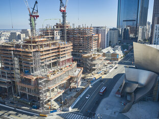 Construction Team Working on Development of The Grand LA, Multiple Levels Already Developed, Staging and Cranes Located in Image