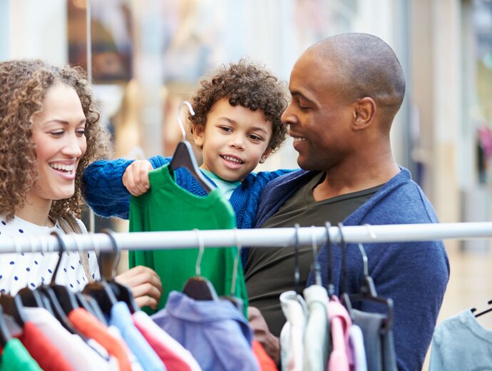 Parents Shopping with Toddler, Father Holding Toddler in His Arms