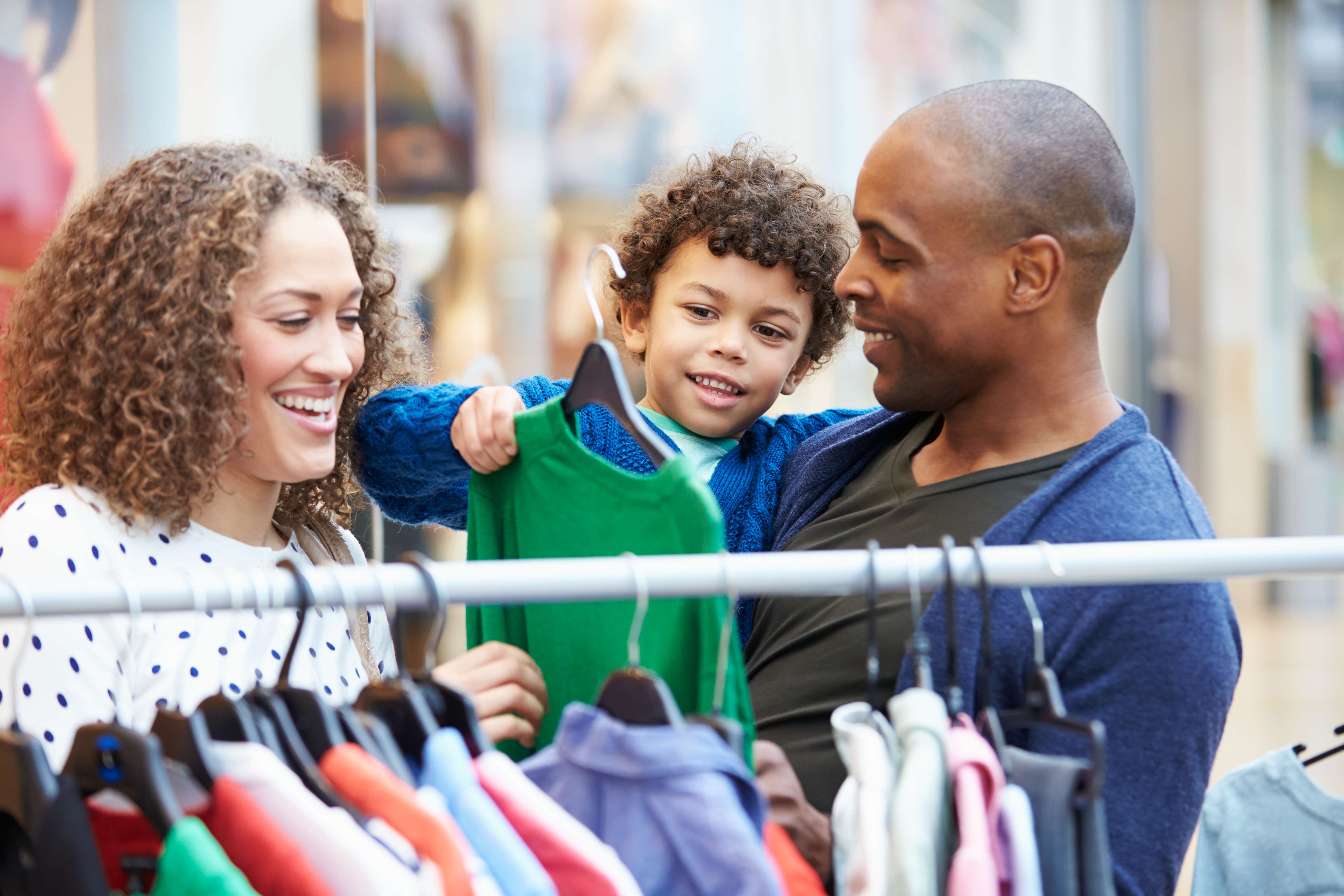 Parents Shopping with Toddler, Father Holding Toddler in His Arms