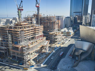 Construction Team Working on Development of The Grand LA, Multiple Levels Already Developed, Staging and Cranes Located in Image