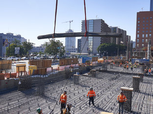 Construction Team Working on Development of The Grand, Crane Lifting Beams