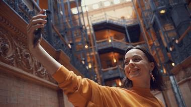 Happy Tourist Selfie in Yellow