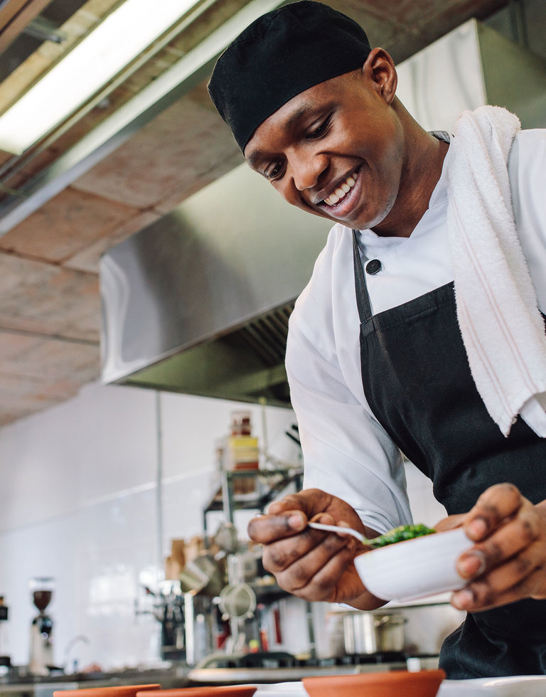 Male Chef in Kitchen, Preparing a Meal