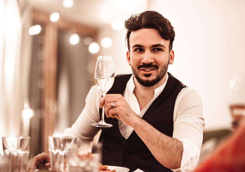 Man Drinking fromMan Wearing Black Vest Drinking Water from Wine Glass